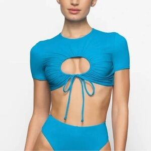 New Swims Blue Crop Ruched Cut Out swim shirt in Turquoise size small